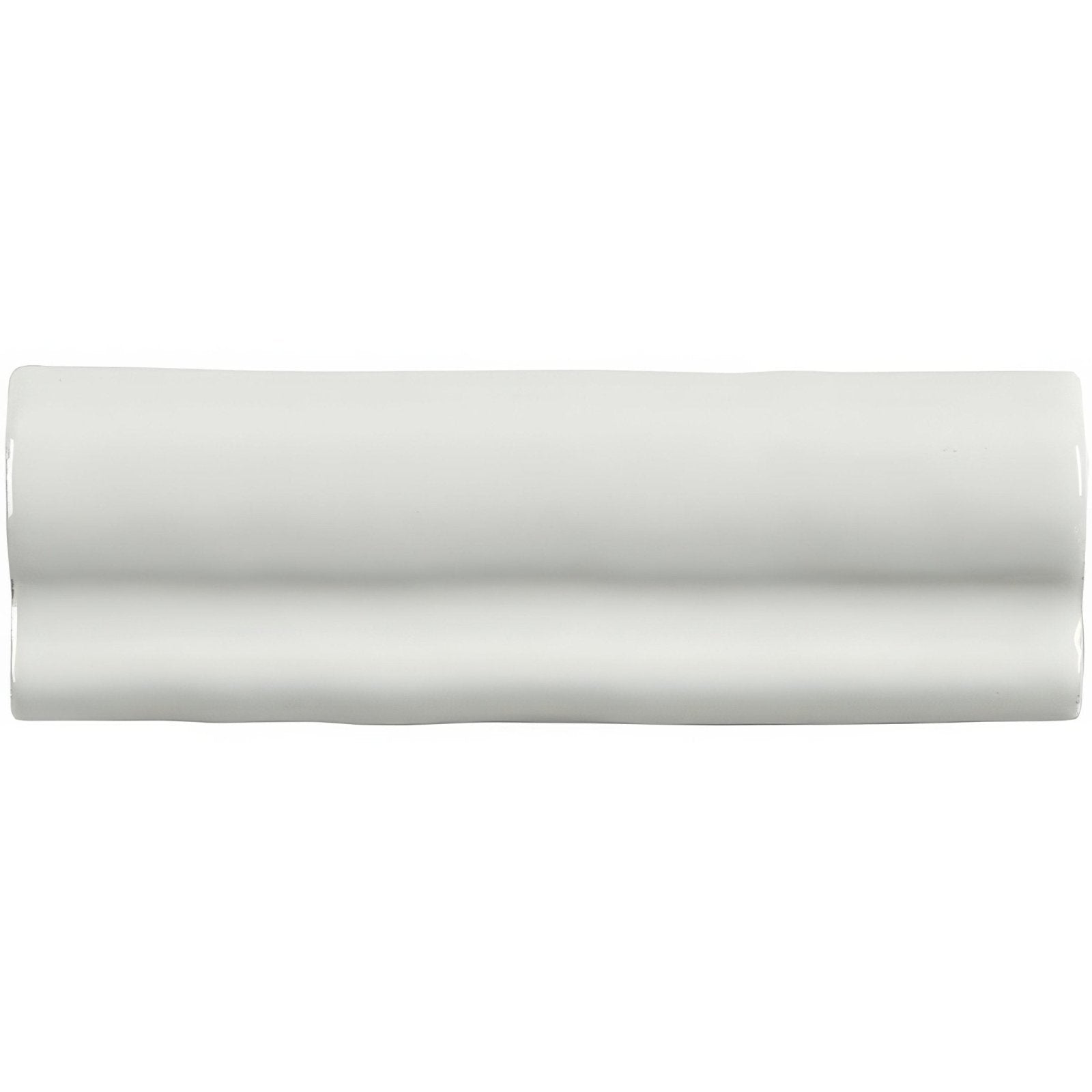 A sleek glossy white ceramic chalk torus moulding tile with subtle wavy texture along its rectangular edges