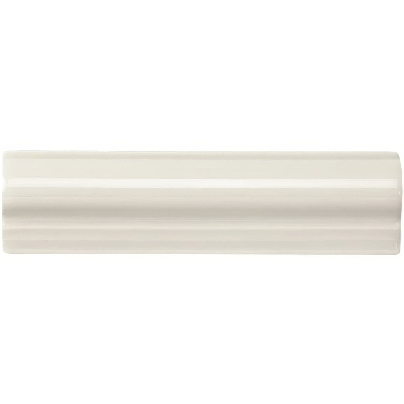 Cream-colored glossy ceramic baseboard tile with classic three-ridge design from chancel grey albert moulding product
