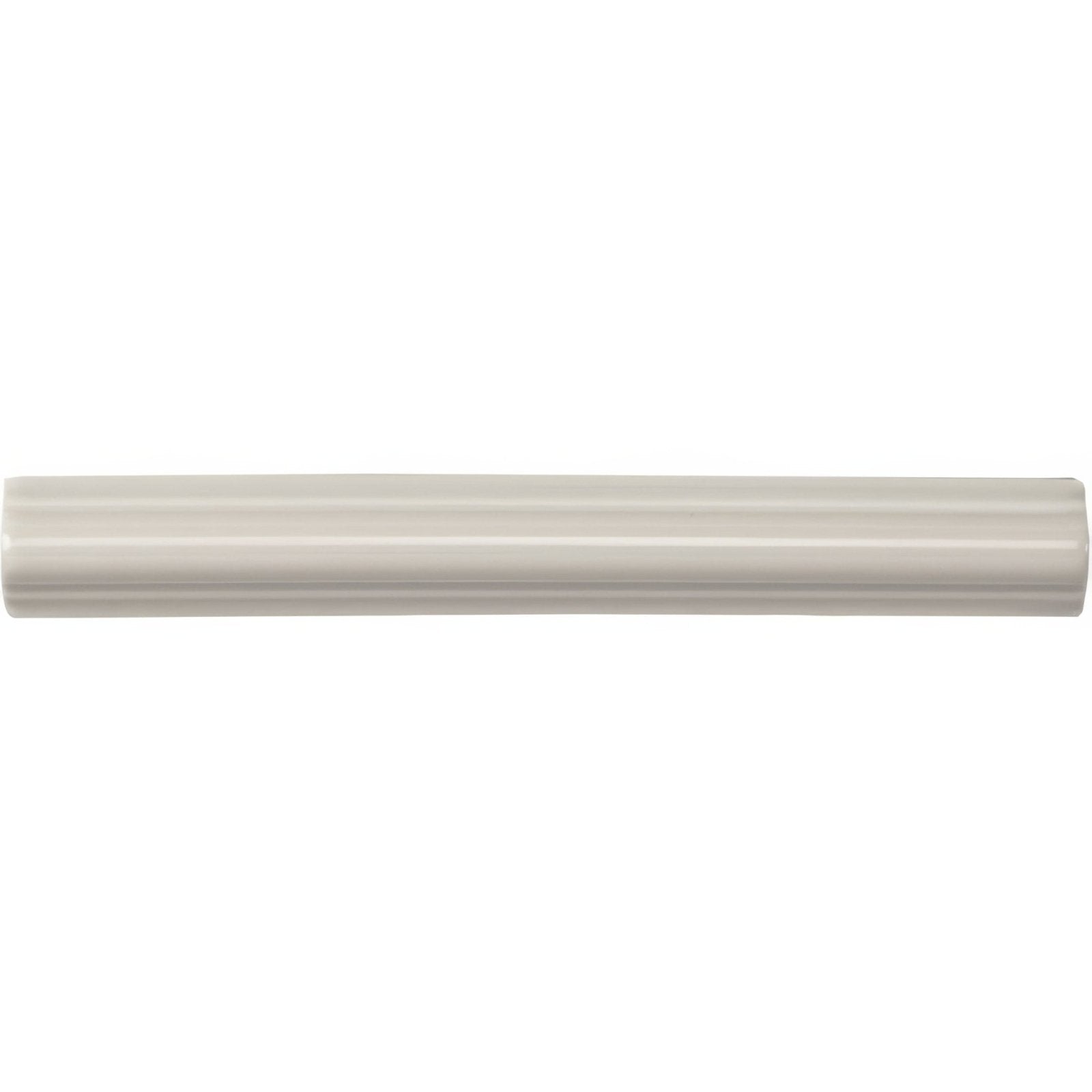 Chancel Grey astragal moulding in cream-colored glossy ceramic tile with subtle ribbed texture along its length