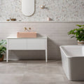 Pink basin on a white vanity in a bathroom tiled in Chancel Grey Large Brick