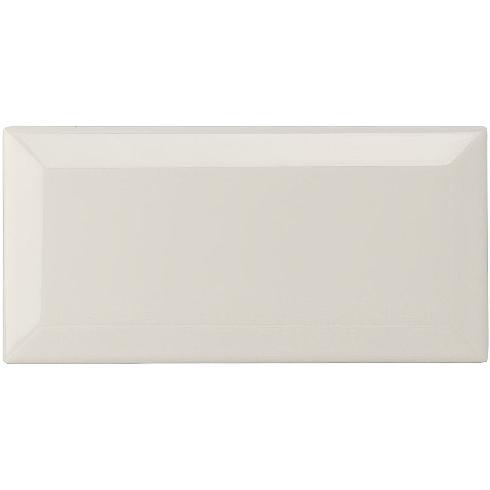 Cream-colored rectangular ceramic chancel grey metro bevelled tile with glossy finish and slightly raised edges