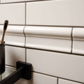 Chancel Grey Victoria Moulding above gloss metro tiling, with pale grey grout joints