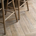Gray wood grain herringbone patterned porcelain oak floor tiles in chatham style for durable stylish flooring