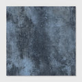 Dark blue chemistry porcelain denim tile with textured mottled weathered finish for interior surfaces