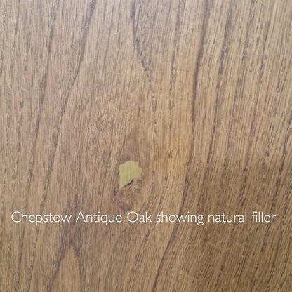 Chepstow antique oak wood surface with natural light brown grain and knot filled with matching beige filler