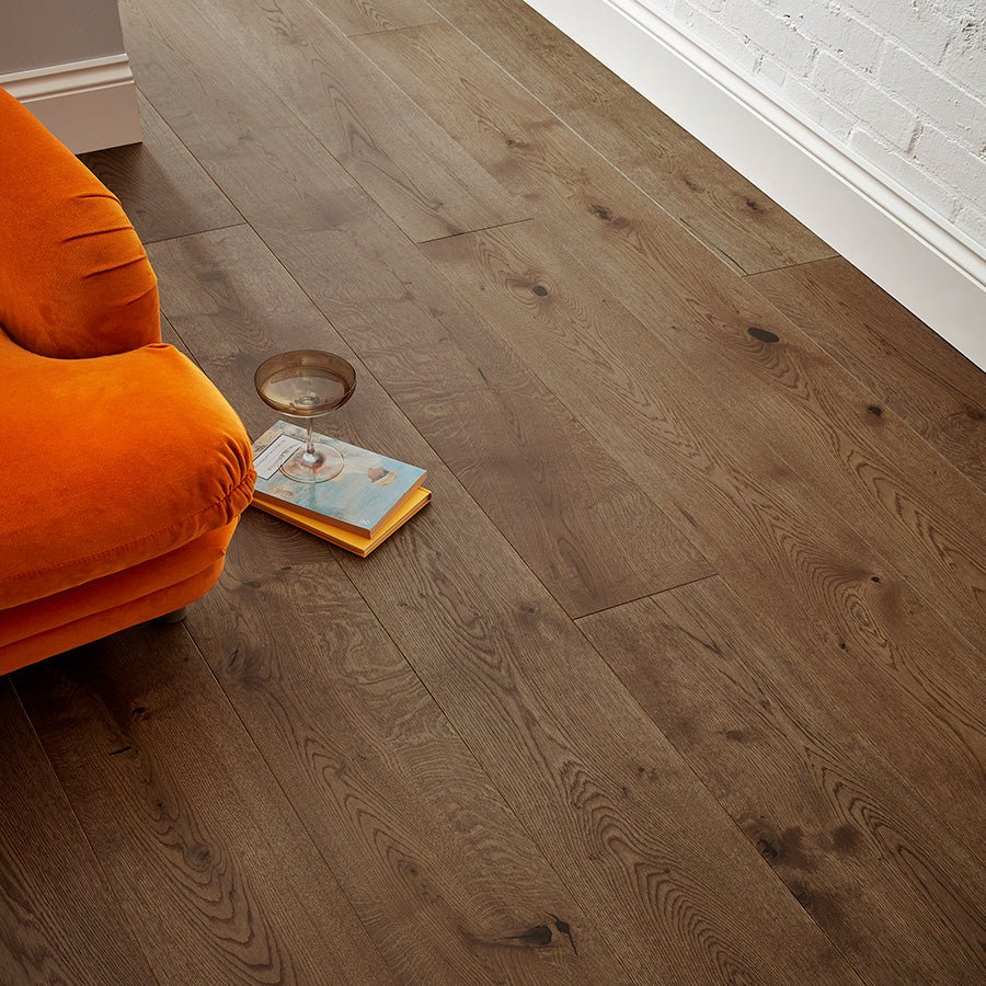 Dark brown hardwood floor with natural wood grain and subtle knots in chepstow antique oak finish