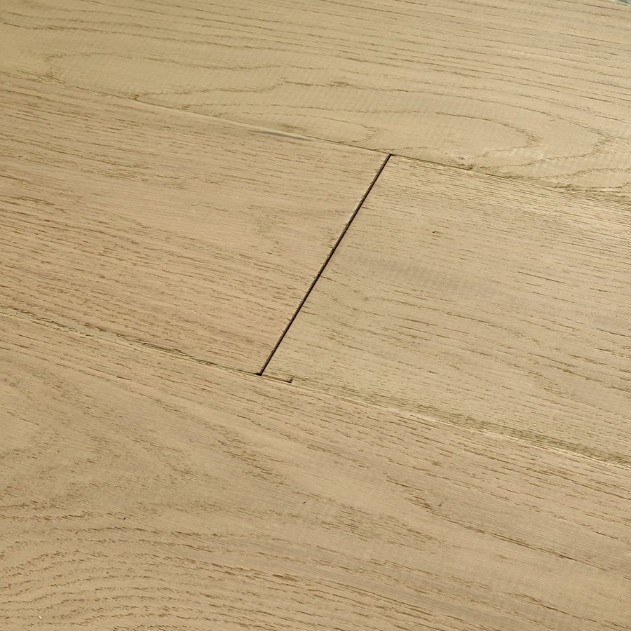Light oak chepstow shale oak hardwood floor planks with natural wood grain and visible expansion gaps between boards