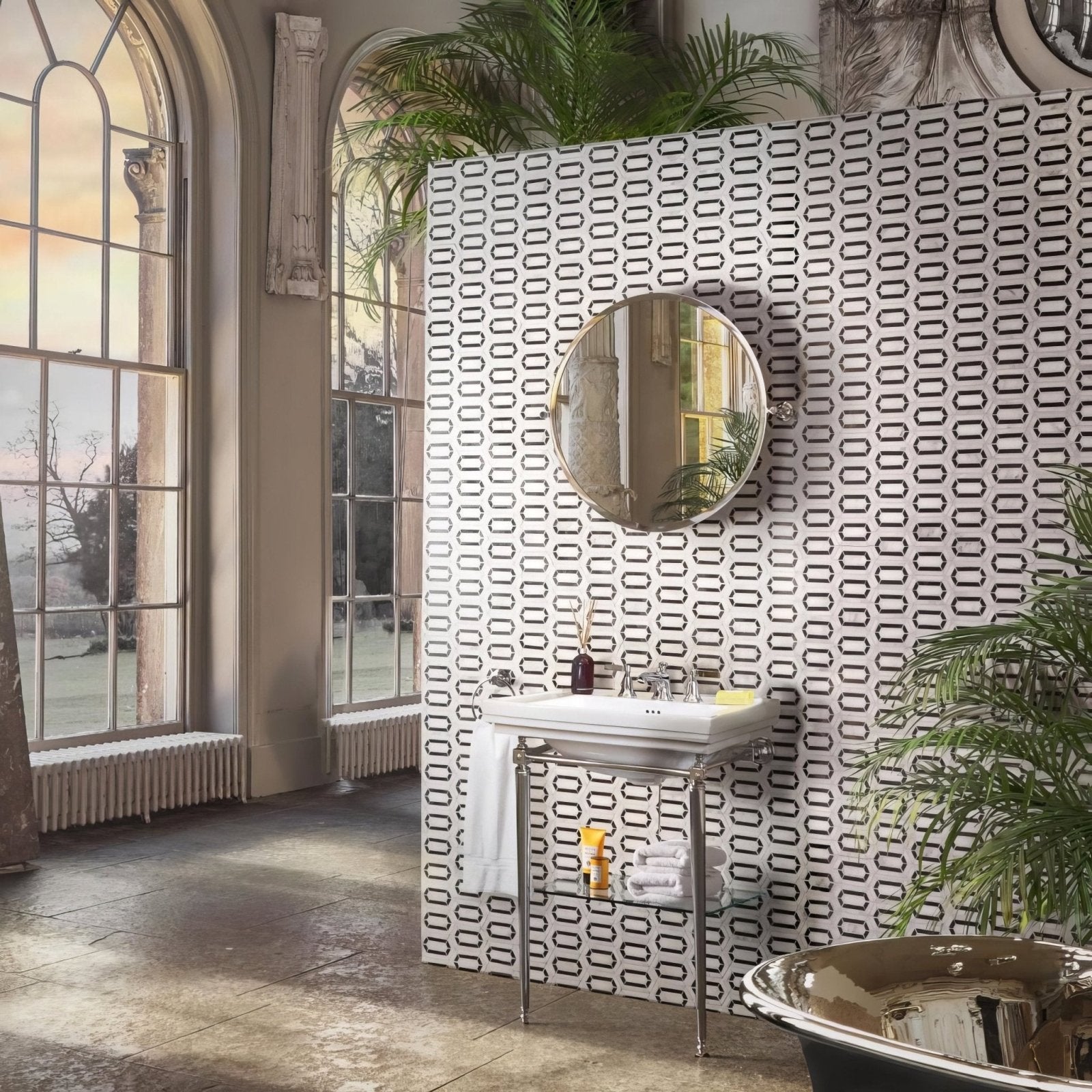 Chequers Court Double Hexagon white and black hexagon mosaic floor with a white sink on chrome legs and a round mirror