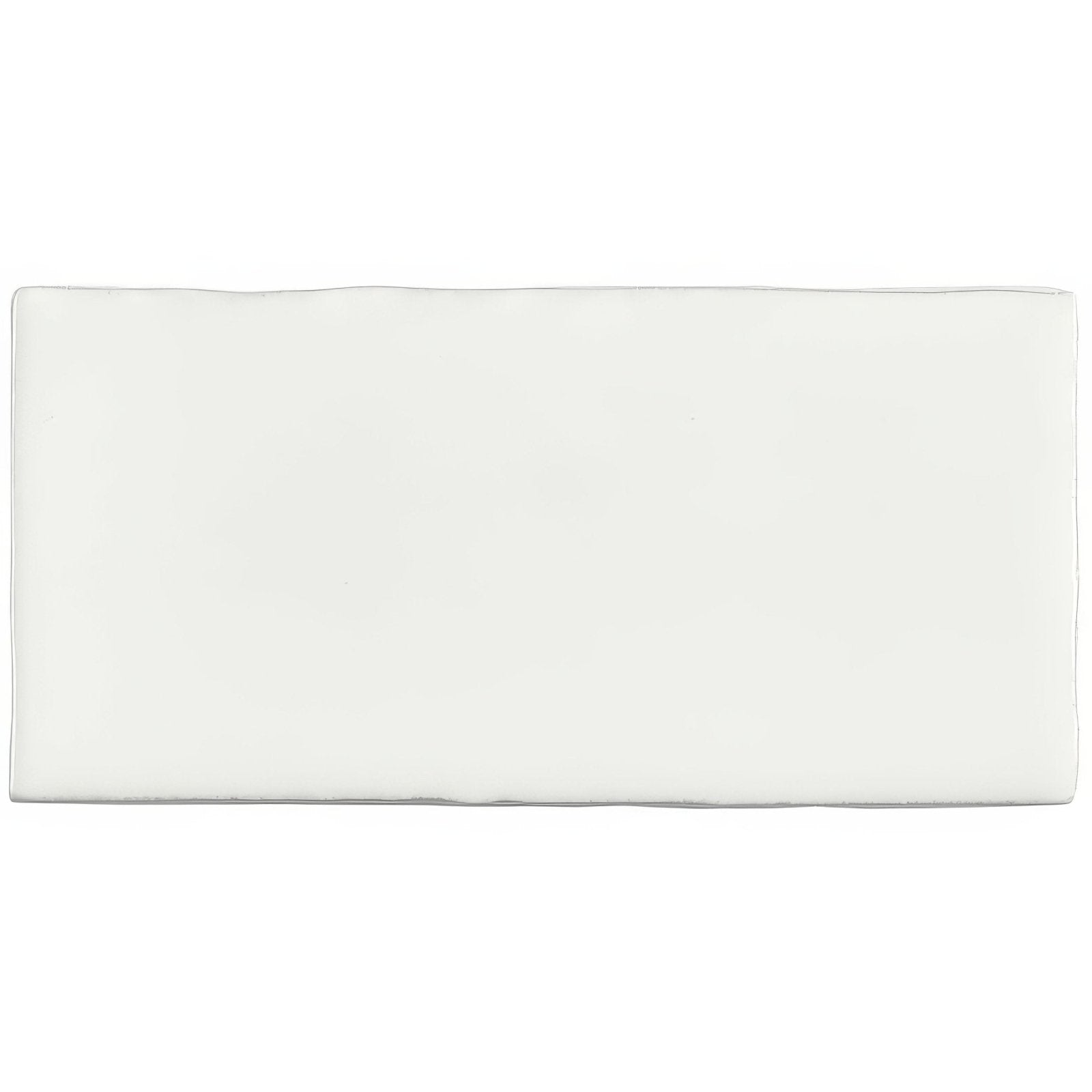 A sleek rectangular white ceramic china white half tile wall tile with smooth glossy finish and rounded edges