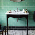 White ceramic sink with black legs and chrome faucet paired with cinema lincoln rectangle glazed tile background