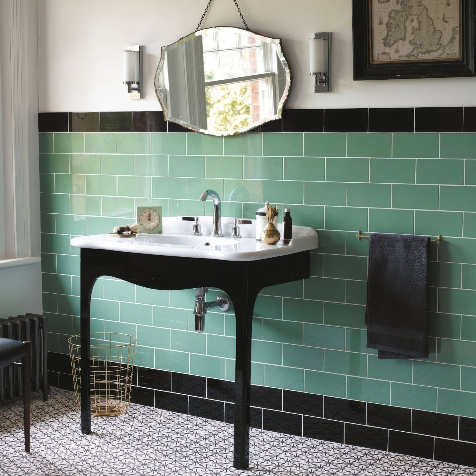 Black vintage-style bathroom sink with white ceramic basin and curved legs shown with Cinema Lincoln rectangle glazed tile