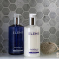 Cirrus Small Stone Hexagon grey marble hexagon mosaic with Elemis shampoo and conditioner bottles