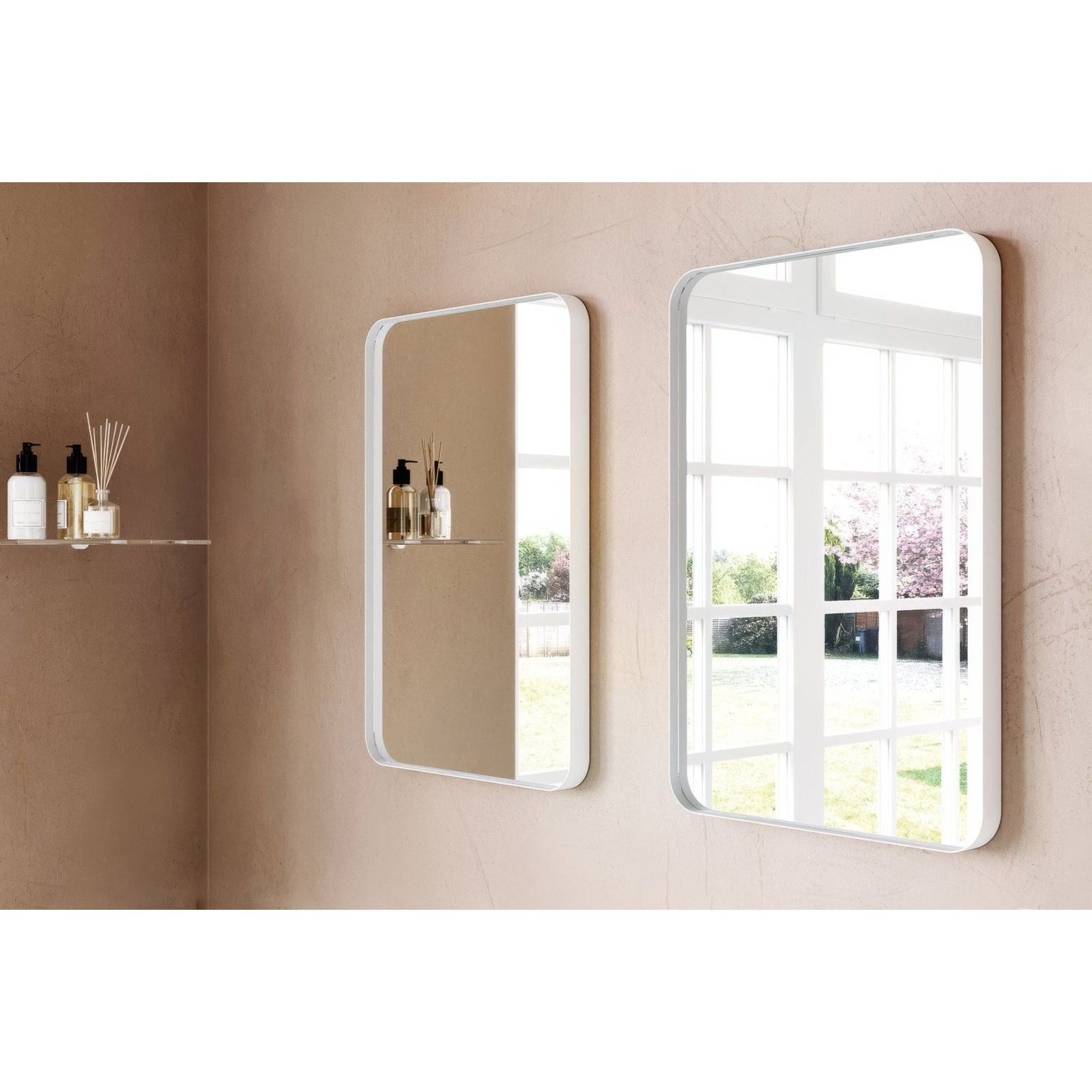 Two city mirror 50x75cm white rectangular mirrors with white frames mounted on a beige wall