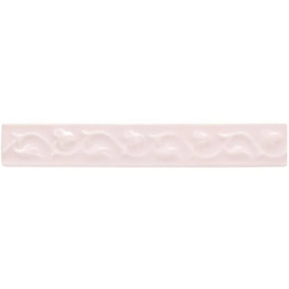 A delicate pale pink ceramic tile clare beaulieu with a subtle embossed wave pattern for decorative use