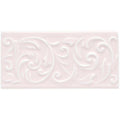 A rectangular matte-finished ceramic tile in soft blush pink with an elegant raised scrollwork pattern clare buckingham