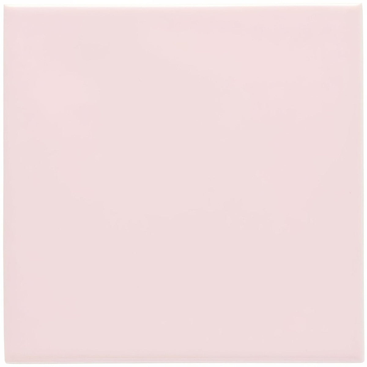 A smooth solid pale pink glossy ceramic square tile from Clare field tile collection