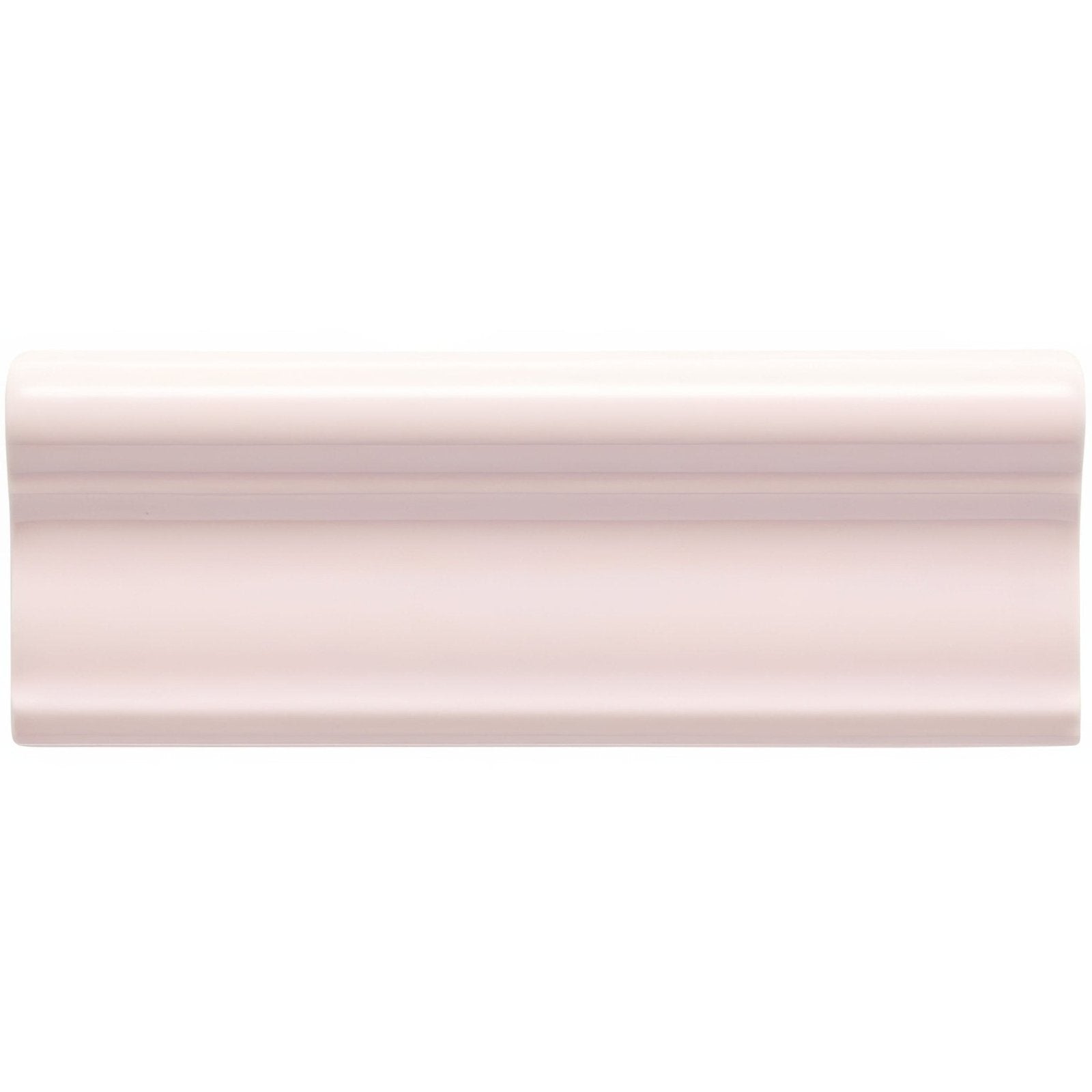 A matte off-white ceramic baseboard molding with a smooth curved profile from Clare Hampton