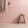Pink herringbone patterned wall tiles featured in clare skirting for decorative interior wall design