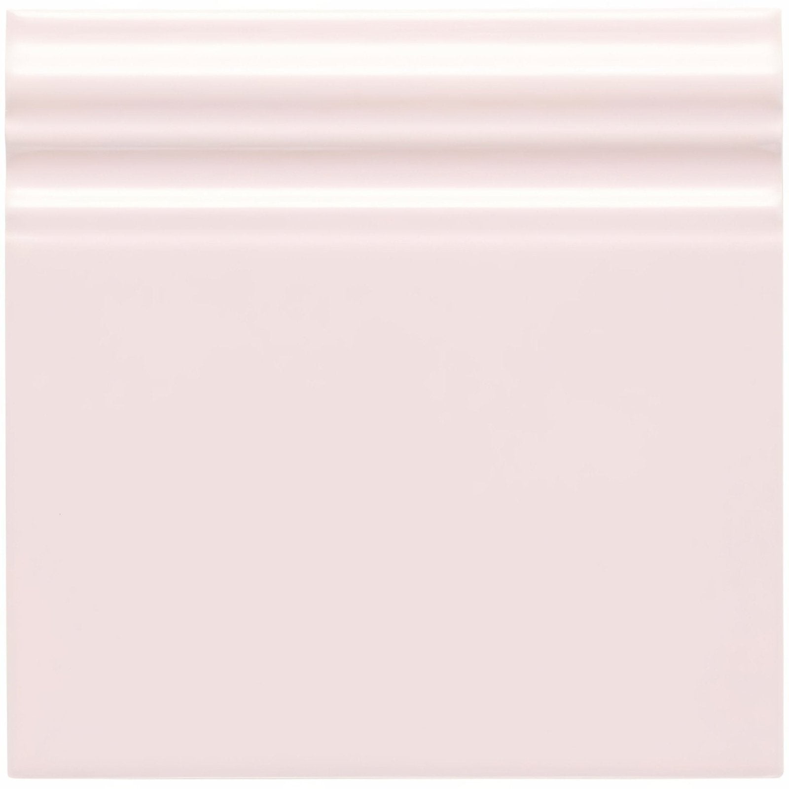 Clare skirting soft blush pink ceramic tile with a smooth glossy finish and subtle horizontal ridges on the top edge