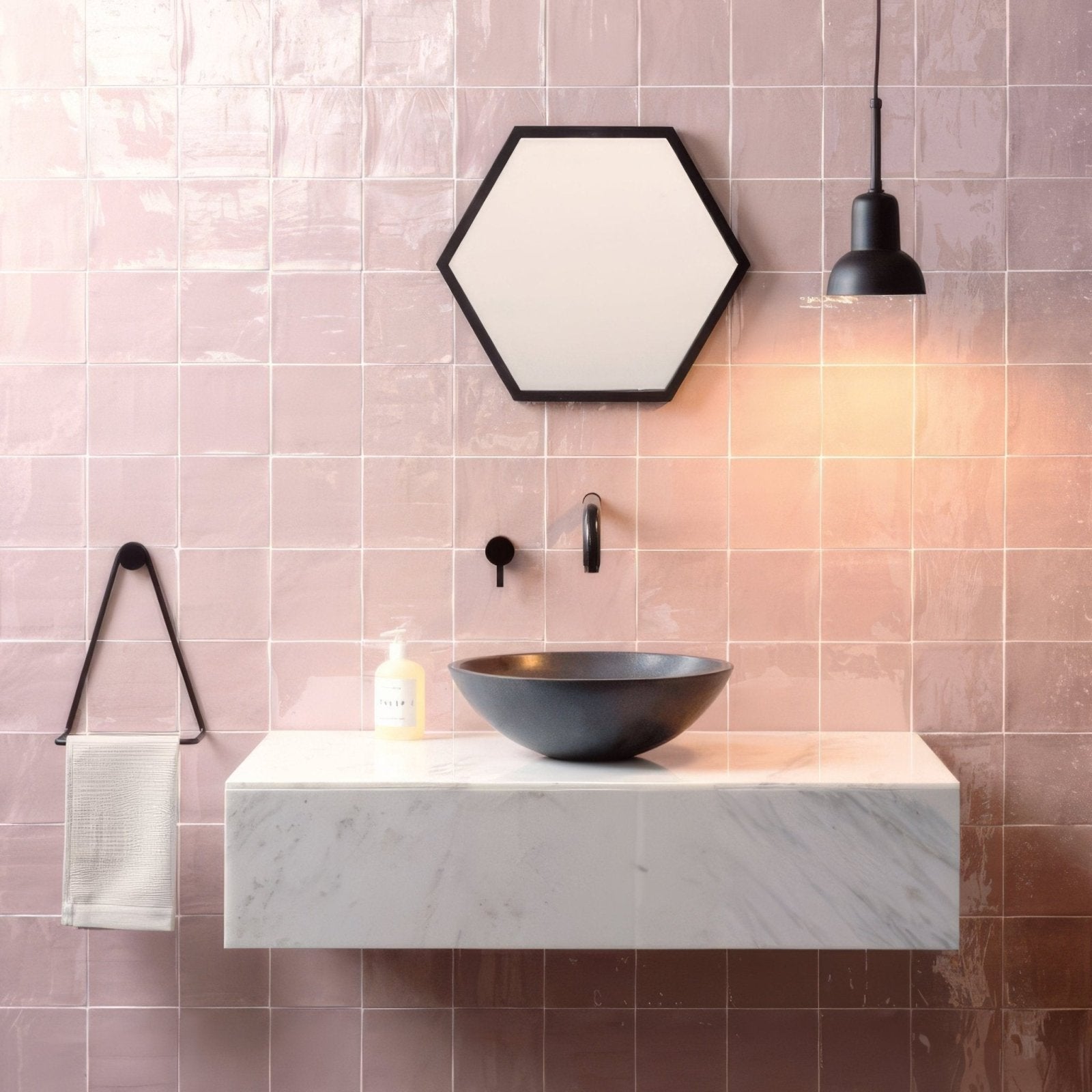 Black ceramic bowl sink with matte finish on white marble countertop in clover field tile setting