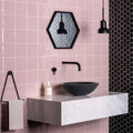 Black matte ceramic bowl sink with modern minimalist design on white marble countertop for clover field tile