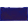 A glossy royal blue rectangular ceramic tile with rounded edges called cobalt blue half tile