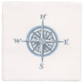 White ceramic coaster with a blue and gray compass rose design featuring cardinal directions in compass blue on cotton design