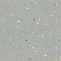 Confetti blue terrazzo effect tile in gray with yellow white black and light blue specks for decorative flooring and walls