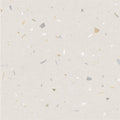 Beige confetti cream terrazzo effect tile with scattered gray gold and white fragments surface design