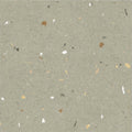 Confetti green terrazzo effect tile in gray with scattered white brown and black specks for flooring and walls