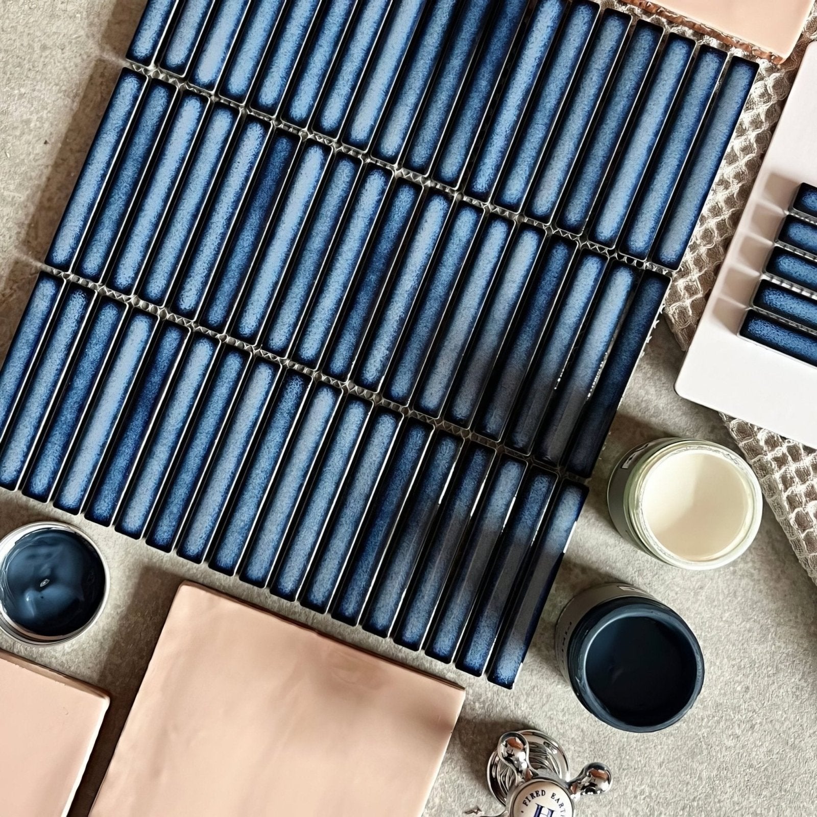 Blue ceramic subway tiles with a glossy gradient finish arranged in neat rows from the copenhagen kit kat blue mosaic