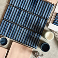Blue ceramic subway tiles with a glossy gradient finish arranged in neat rows from the copenhagen kit kat blue mosaic