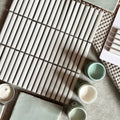 White rectangular ceramic tiles in a grid pattern from the copenhagen kit kat white mosaic collection