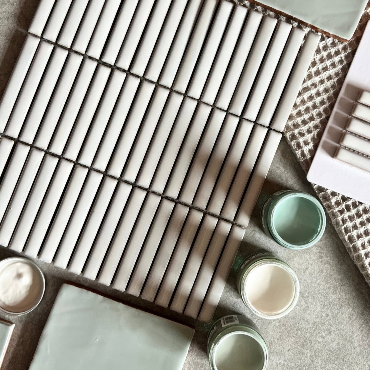 White rectangular ceramic tiles in a grid pattern from the copenhagen kit kat white mosaic collection
