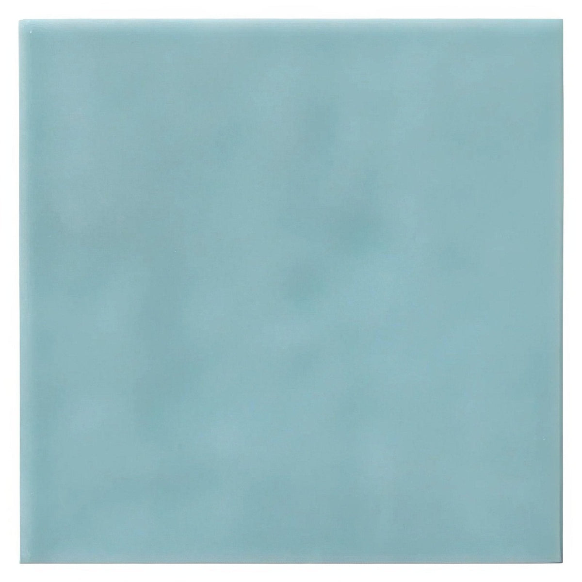 A square matte finished ceramic tile in soft seafoam green from the cordoba lagoon glazed tile collection