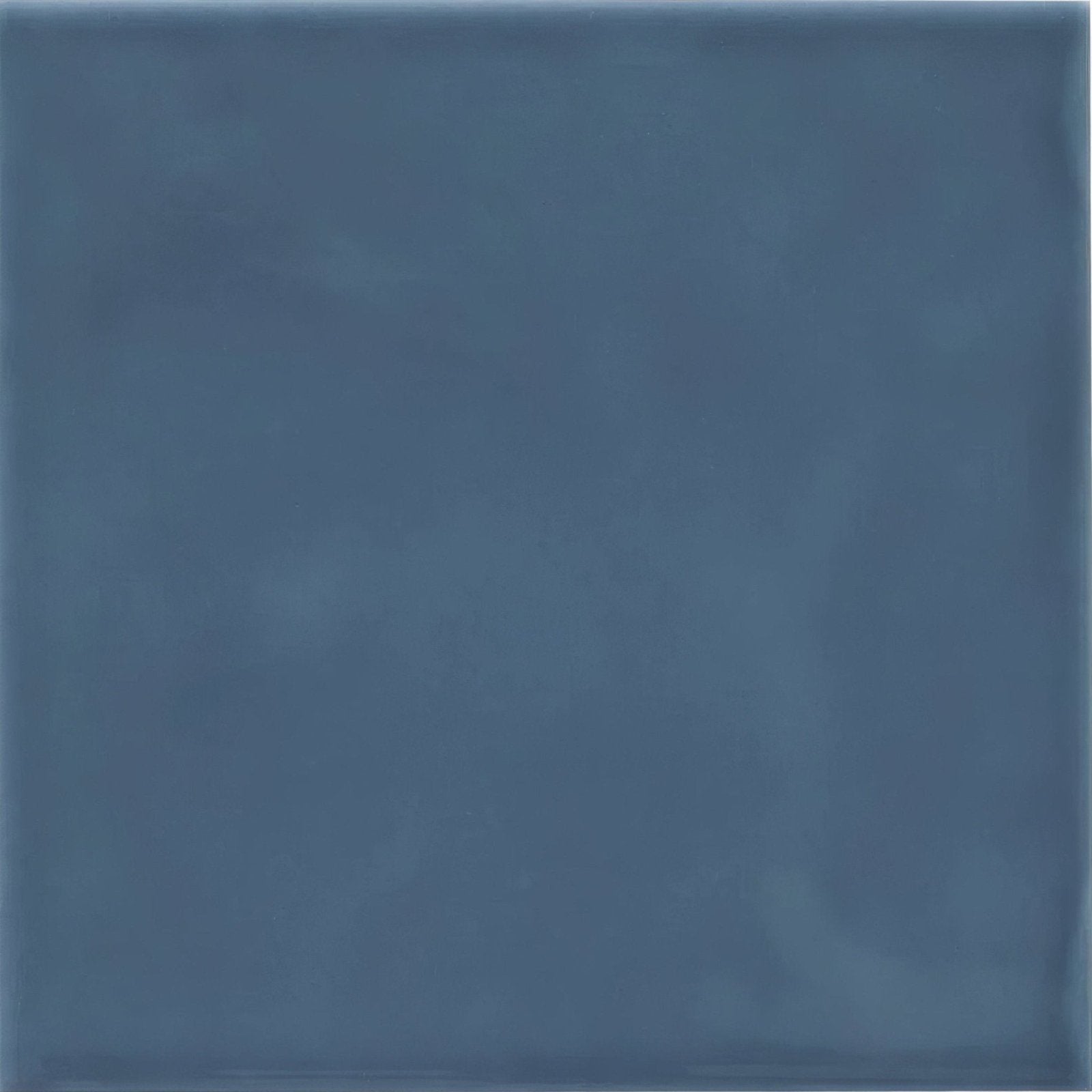 A square blue Cordoba Ocean glazed ceramic tile with a matte finish and subtle textured tone variations