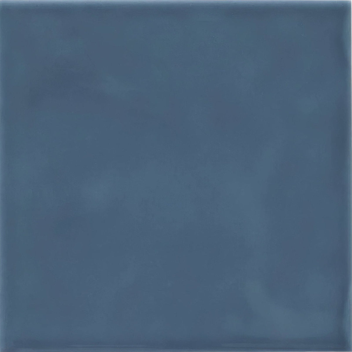 A square blue Cordoba Ocean glazed ceramic tile with a matte finish and subtle textured tone variations