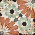 Cordoba petalo 20 x 20cm mosaic tile with geometric floral pattern in terracotta sage green and black starburst designs