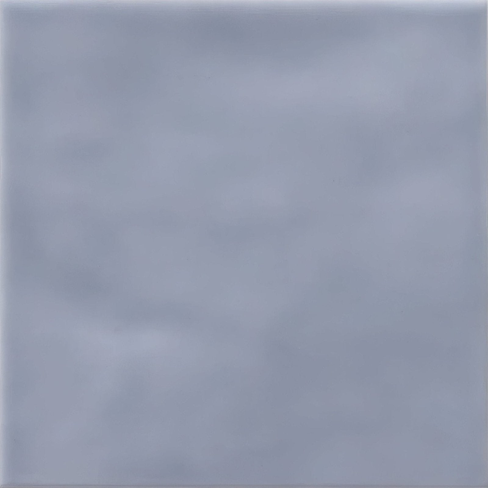A smooth matte finished light gray ceramic tile with subtle veining cordoba sea mist glazed tile