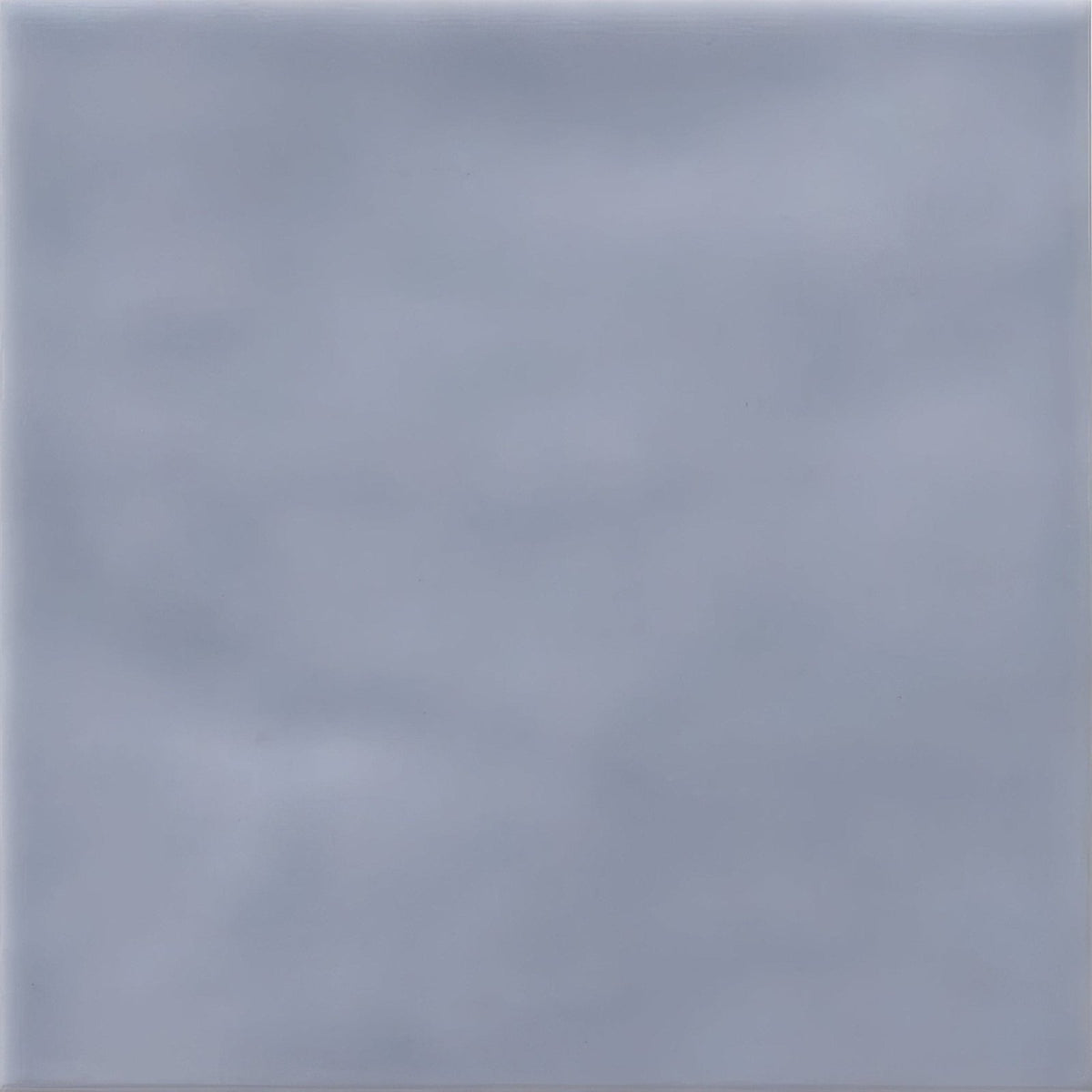 A smooth matte finished light gray ceramic tile with subtle veining cordoba sea mist glazed tile