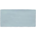 A rectangular matte-finished light blue ceramic cornflower brick wall tile with slightly rounded edges 20x10cm