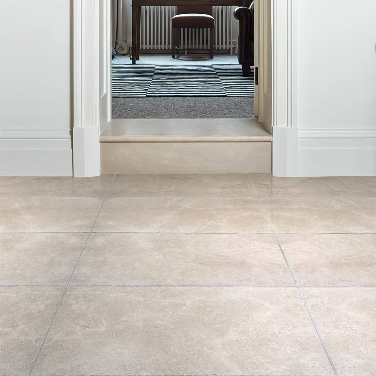 Beige stone-effect porcelain floor tiles with subtle natural veining cotehele opus porcelain sand