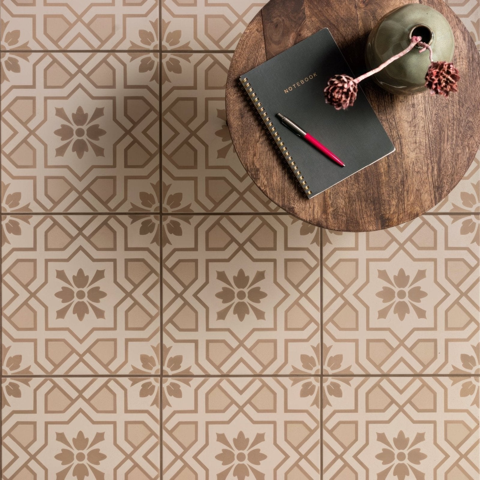 Beige and taupe geometric patterned floor tiles with floral motifs cotele taupe on chalk for indoor flooring