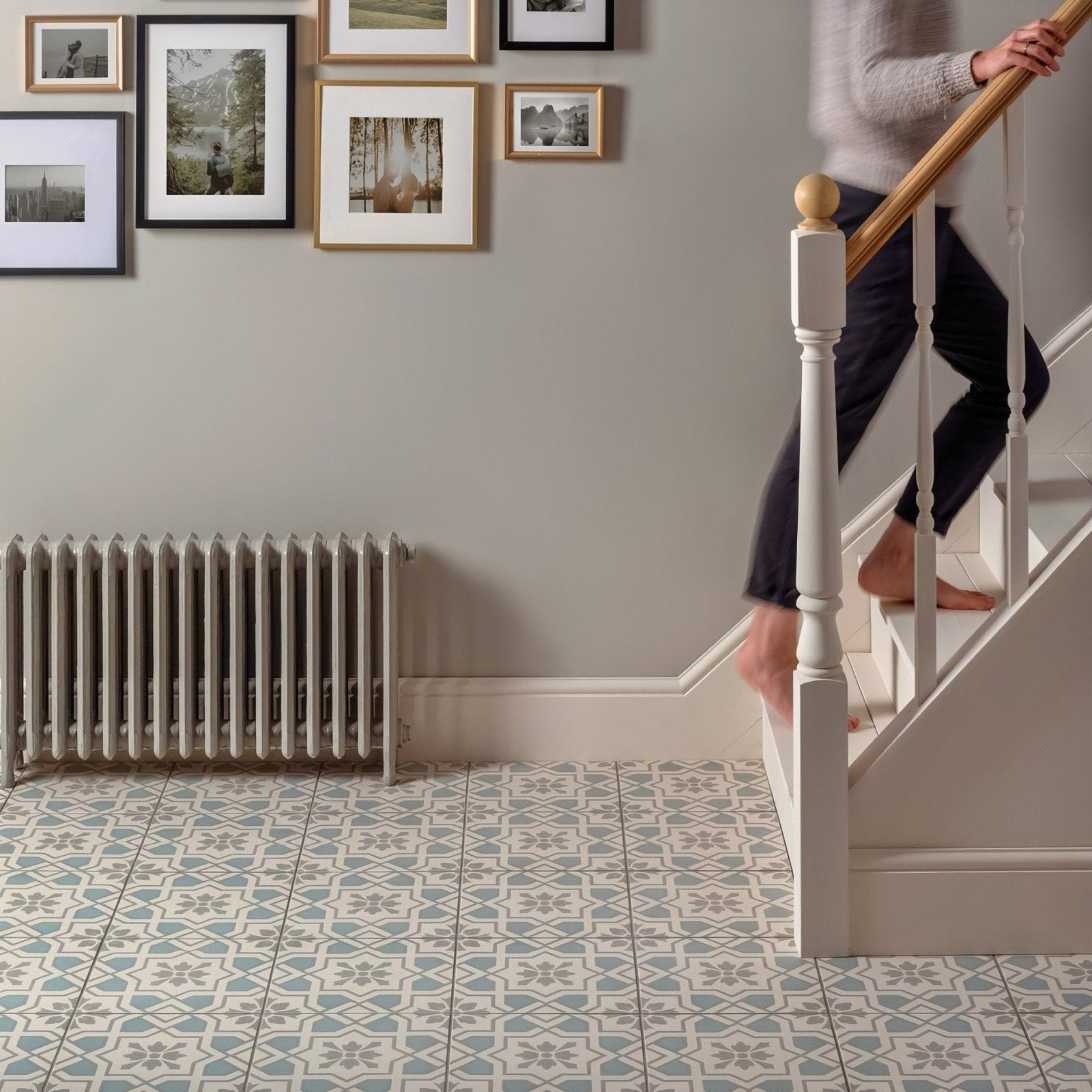 White cast iron radiator with vertical fins and classic design in cotehele teal on chalk finish