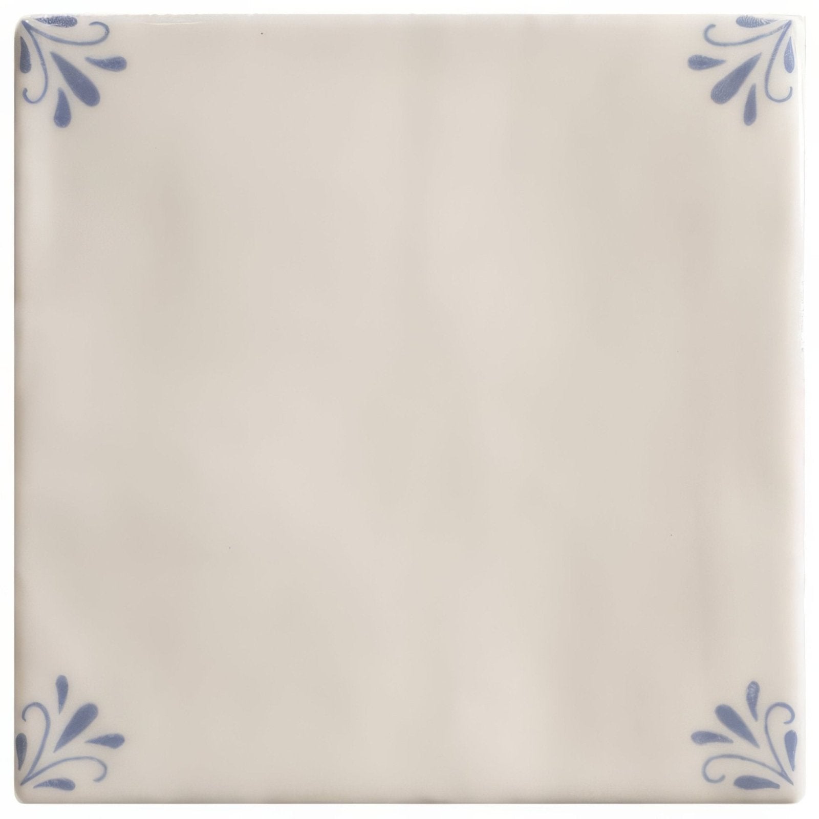 Cream-colored ceramic tile country delft ada with delicate blue floral motifs in each corner