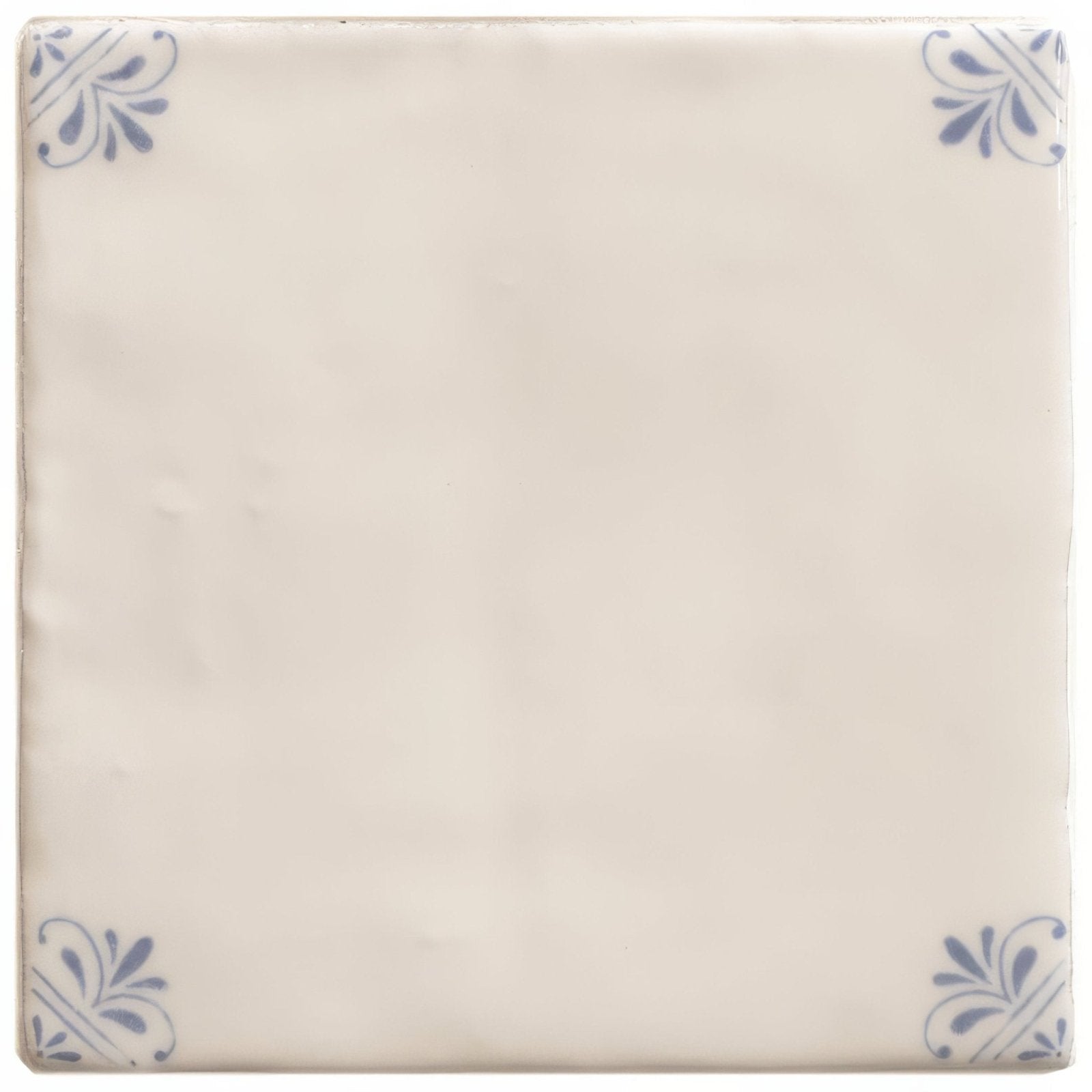 Cream-colored ceramic tile with delicate blue floral motifs in each corner from country Delft Beatrix collection