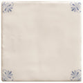 Cream-colored ceramic tile with delicate blue floral motifs in each corner from country Delft Beatrix collection