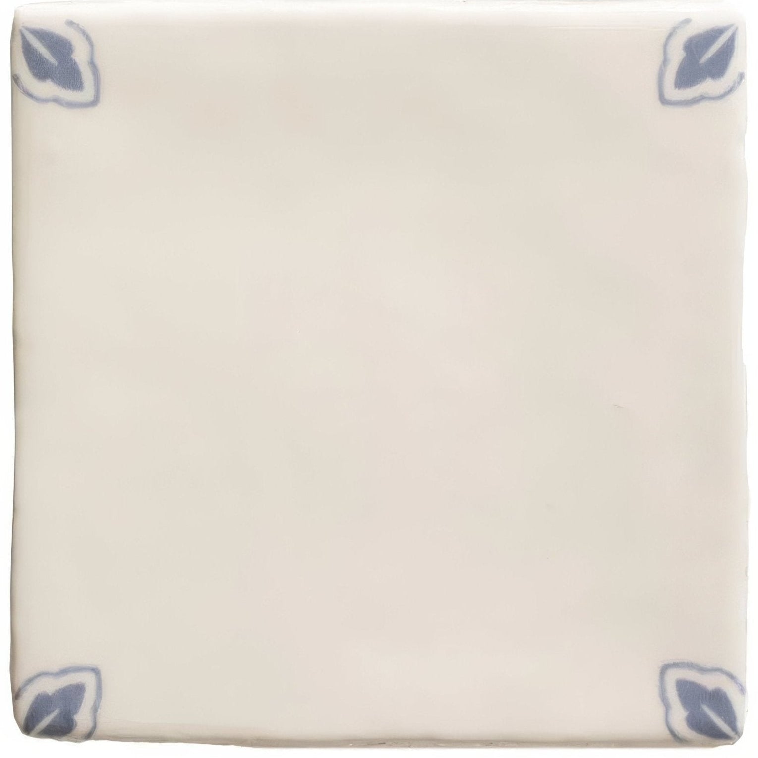 Cream-colored ceramic Country Delft Dorothea tile with subtle blue leaf motifs in each corner for decorative use