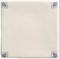 Cream-colored ceramic Country Delft Dorothea tile with subtle blue leaf motifs in each corner for decorative use