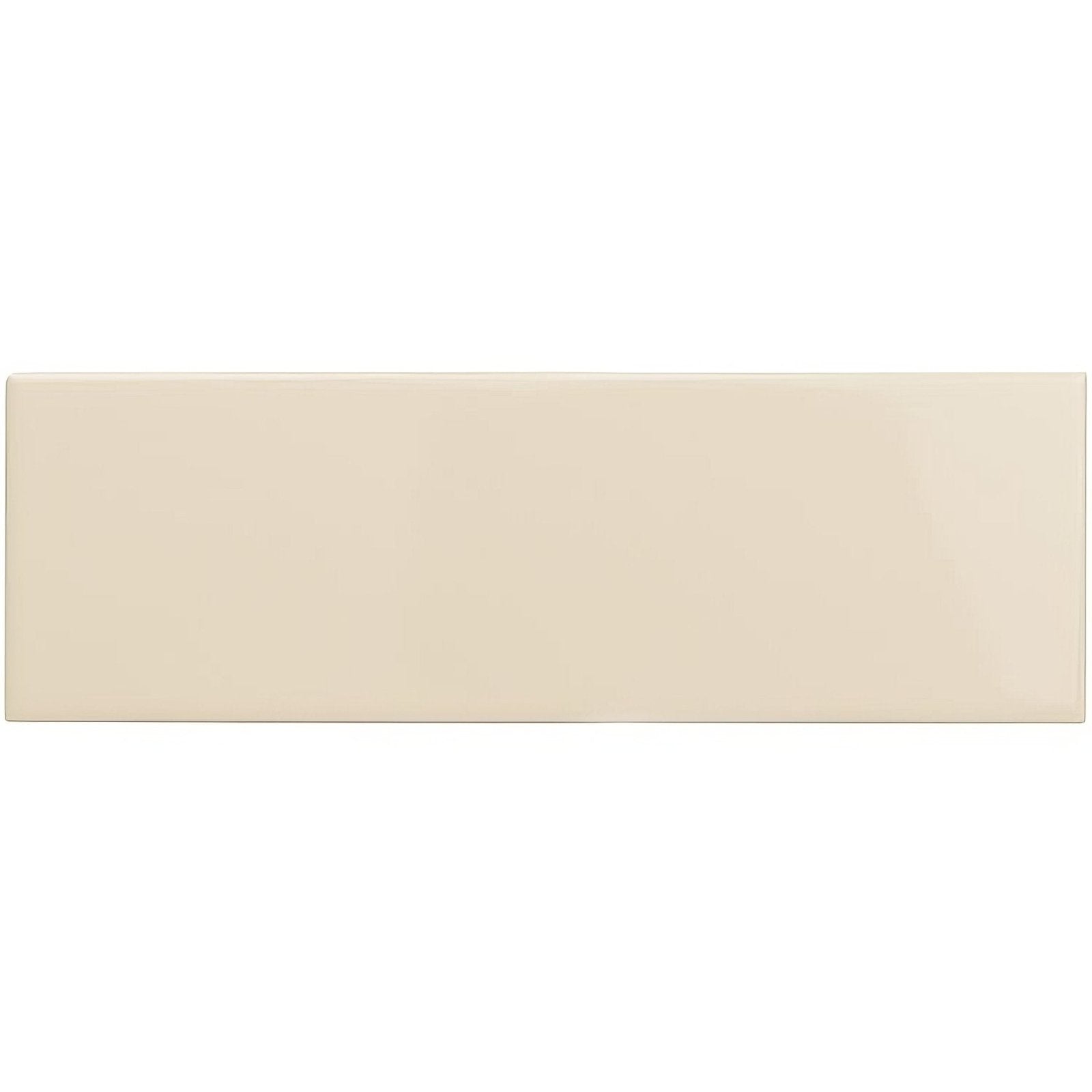 Cream-colored rectangular ceramic tile with smooth glossy finish from county white large brick collection